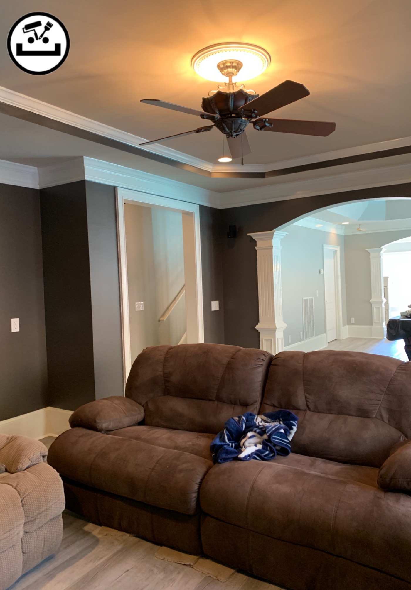 Deep gray living room feature wall framed in white trim